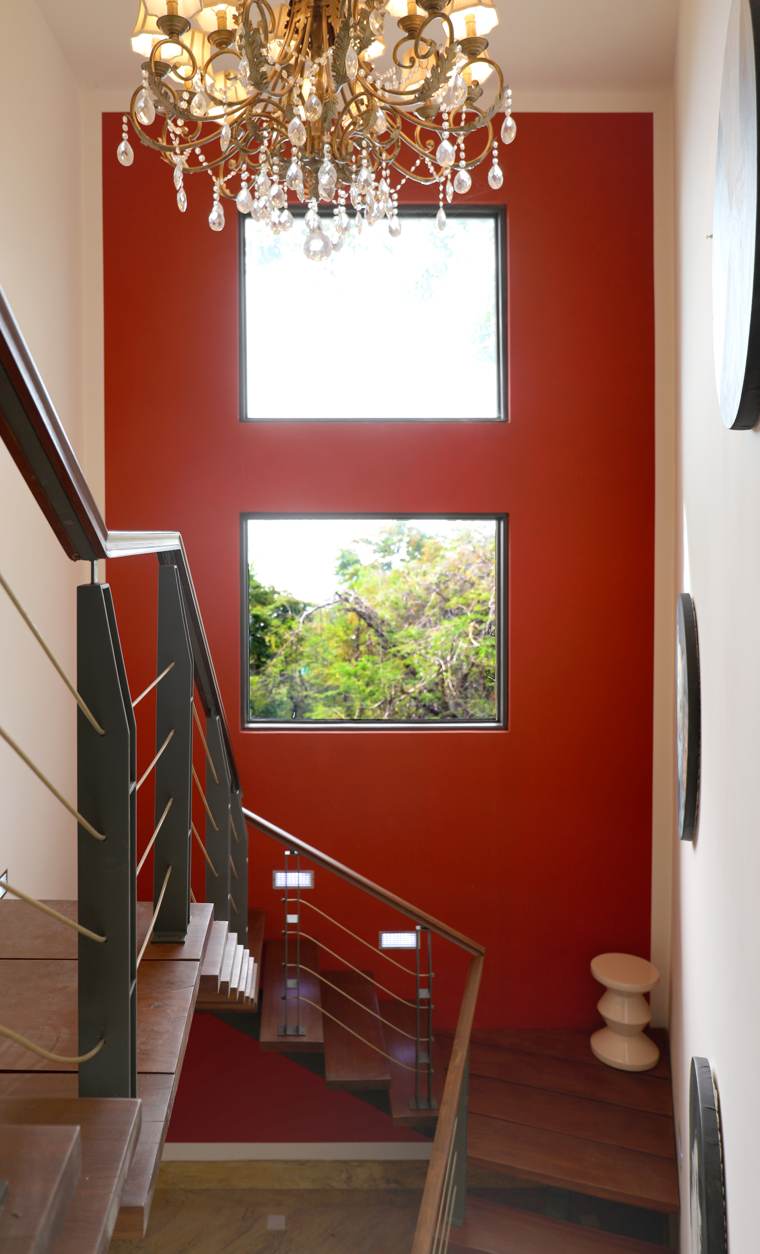 Deep red stairwell wall painting in a domestic interior